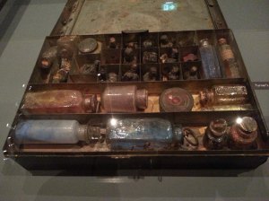 Turner's paintbox - pigs bladders for carrying mixed pigments at the top of the box and jars of ground pigment at the front