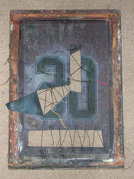 The screen with cut and stitched sections.